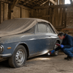Buyer inspecting a long-stored barn find car before purchase