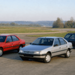 Red and silver Peugeot 405 saloons with a blue Peugeot 405 estate