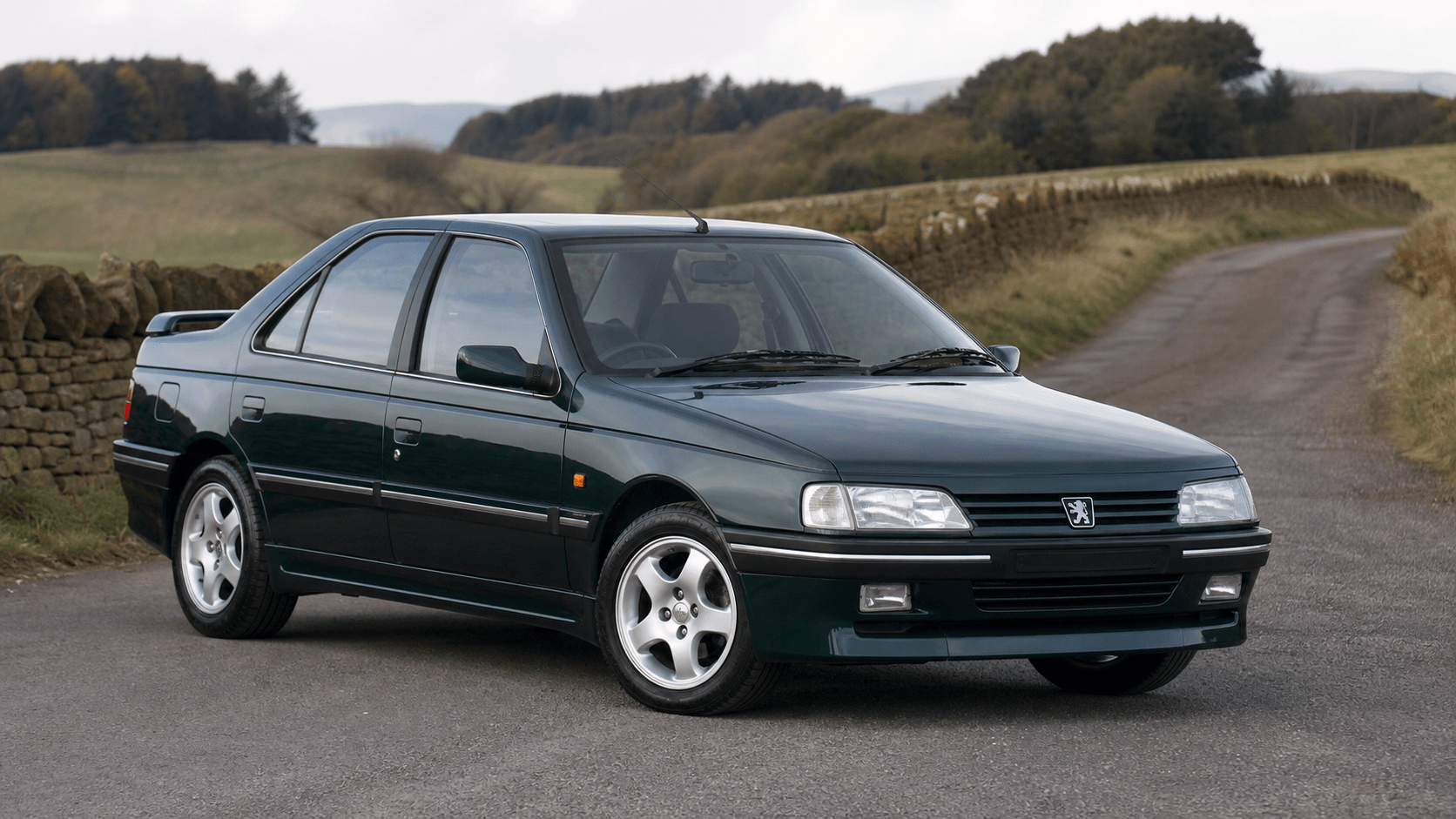 Dark green road-going Peugeot 405 T16 performance saloon