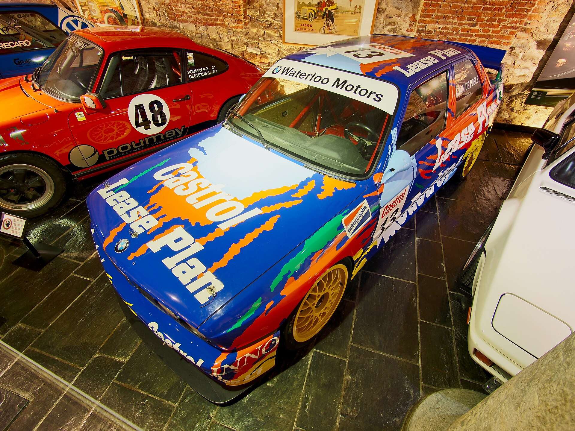 BMW E30 M3 in red and white livery at Spa-Francorchamps Racing Museum