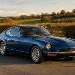 Blue Datsun 240Z-style classic sports car on a British country road