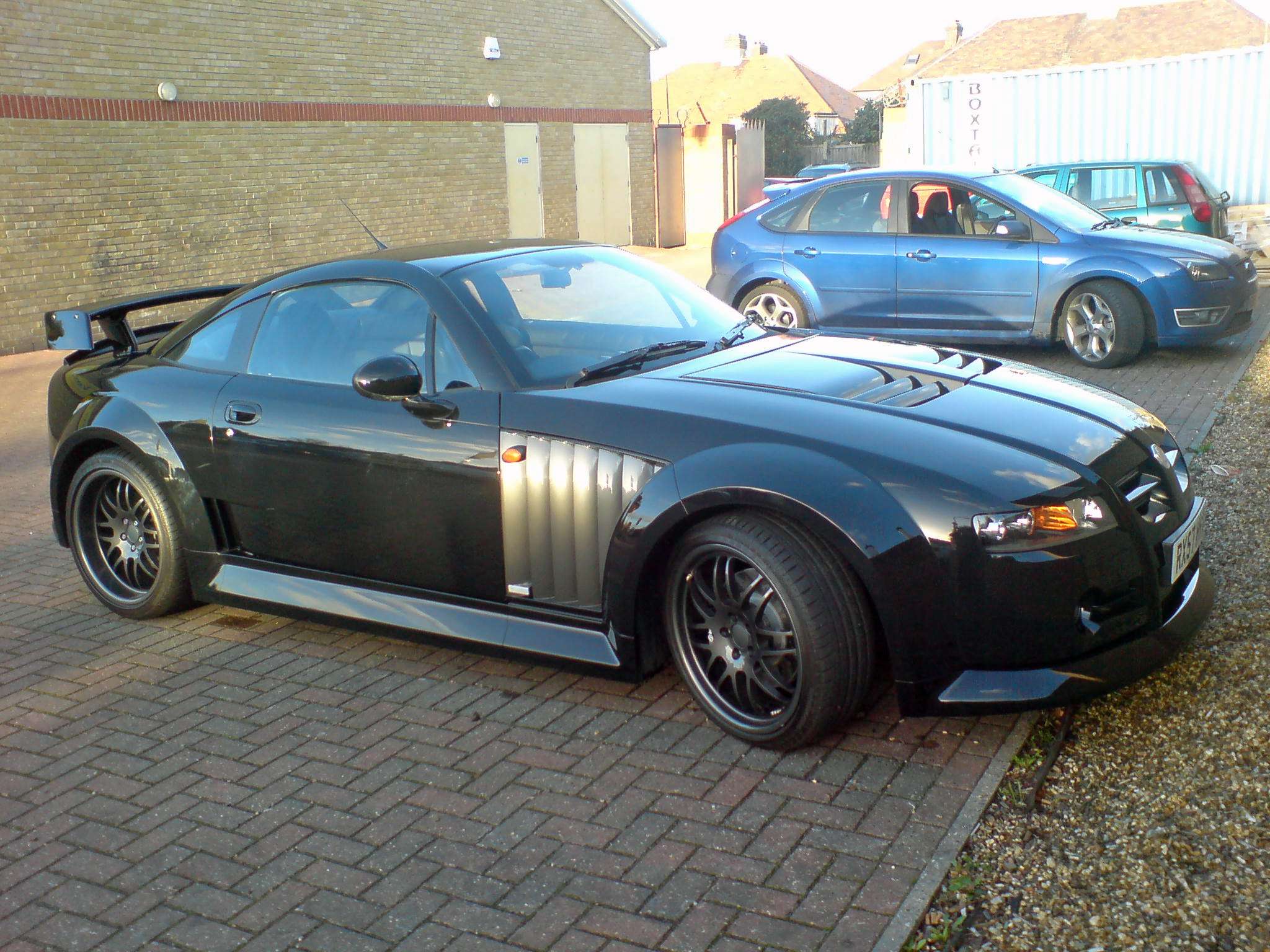 Front view of a black MG XPower SV