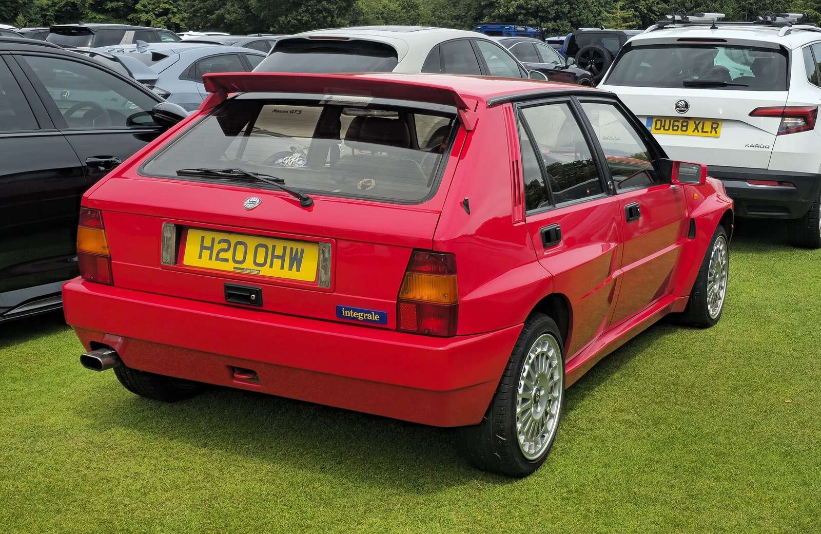 Red 1992 Lancia Delta HF Integrale Evoluzione viewed from the rear three-quarter angle