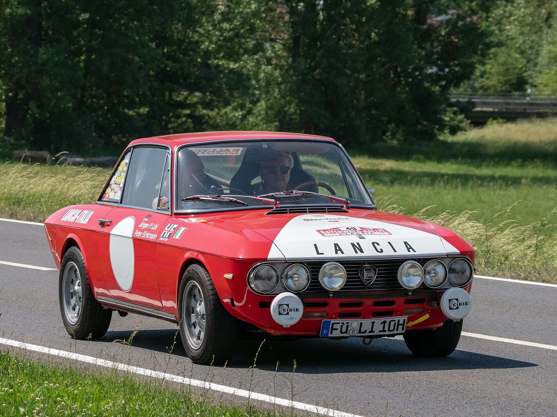 Red Lancia Fulvia Coupé viewed from the front three-quarter angle