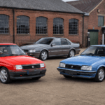 Red Vauxhall Nova, blue Vauxhall Cavalier and silver Vauxhall Carlton outside a British motor museum