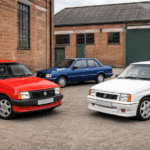 Red Vauxhall Nova GTE, white Nova GSi and blue Nova saloon outside a British industrial building
