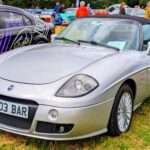 Silver Fiat Barchetta viewed from the front three-quarter angle