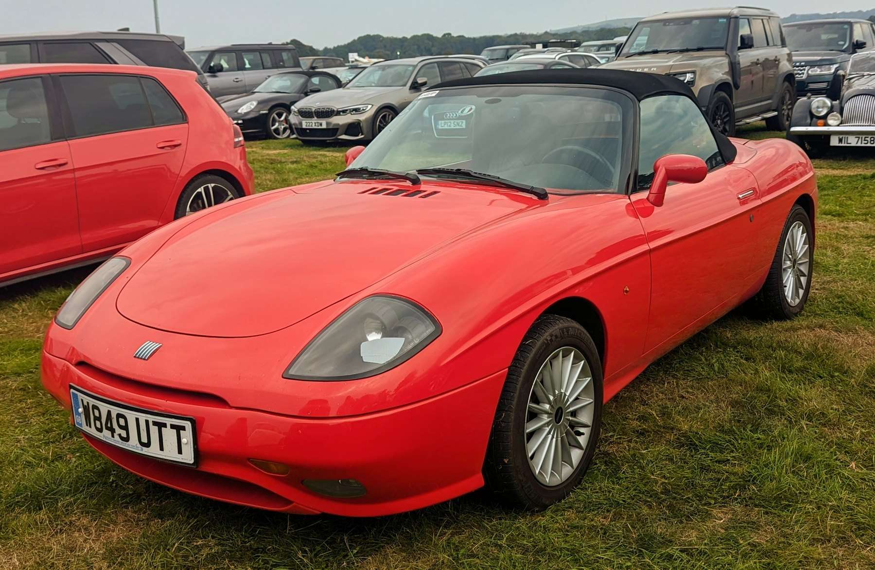 Red early Fiat Barchetta viewed from the front