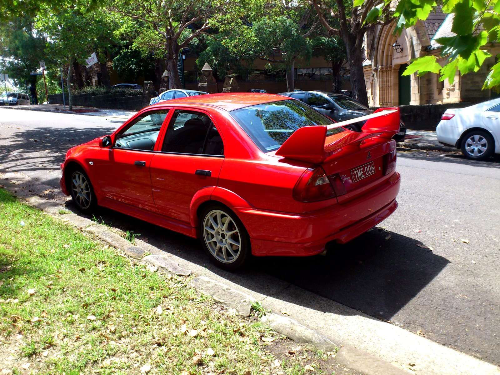 Red Mitsubishi Lancer Evolution VI Tommi Mäkinen Edition front three-quarter view
