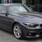 BMW 2018 F32 420i M Sport Coupé, front three-quarter view