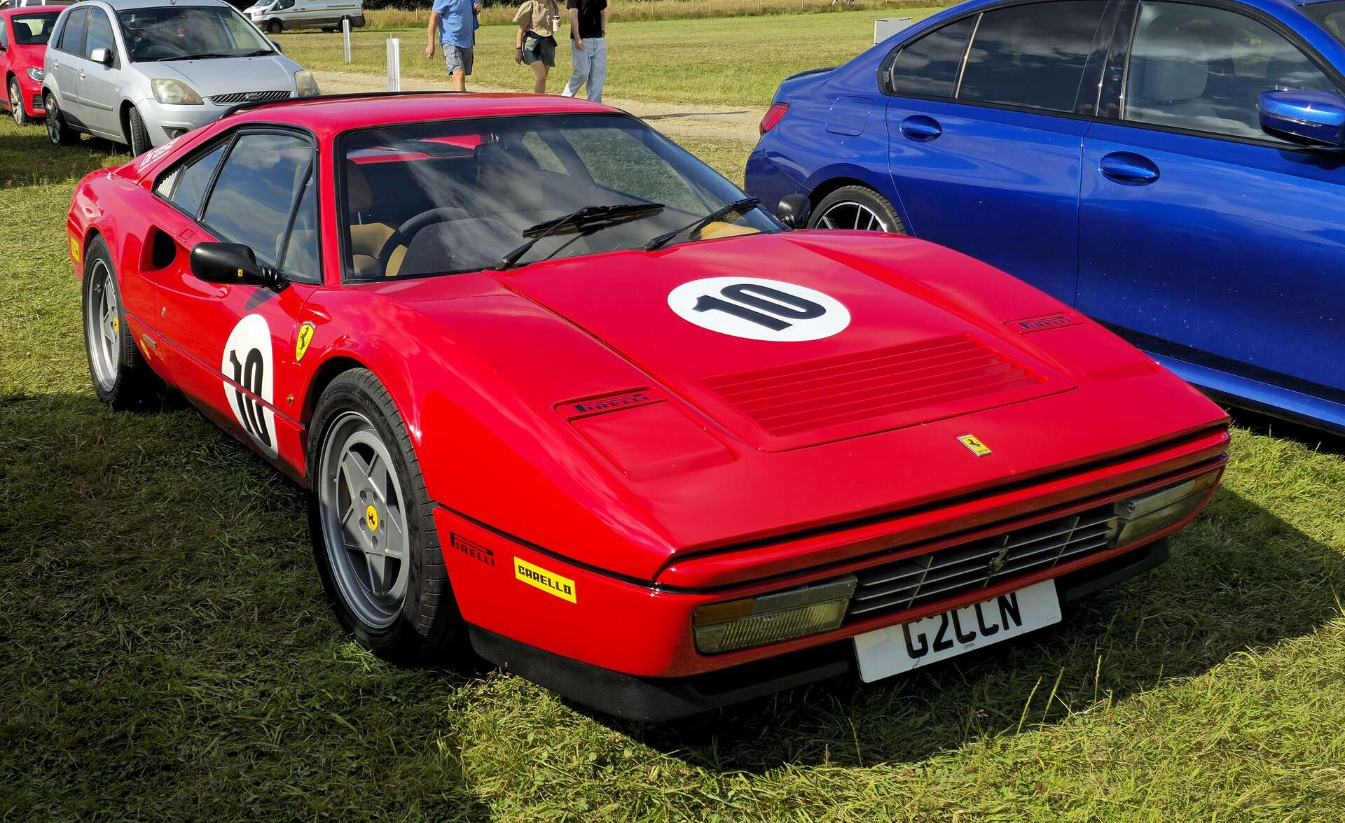 Red Ferrari 328 GTS rear three-quarter