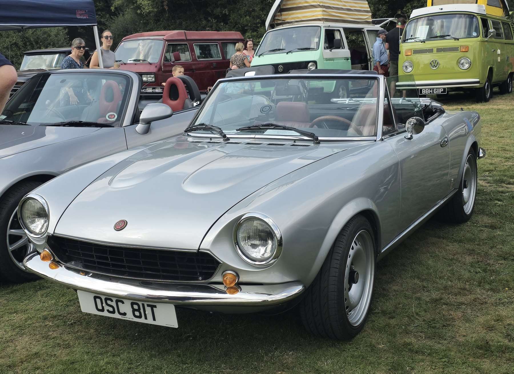 Silver Fiat 124 Sport Spider with the roof lowered