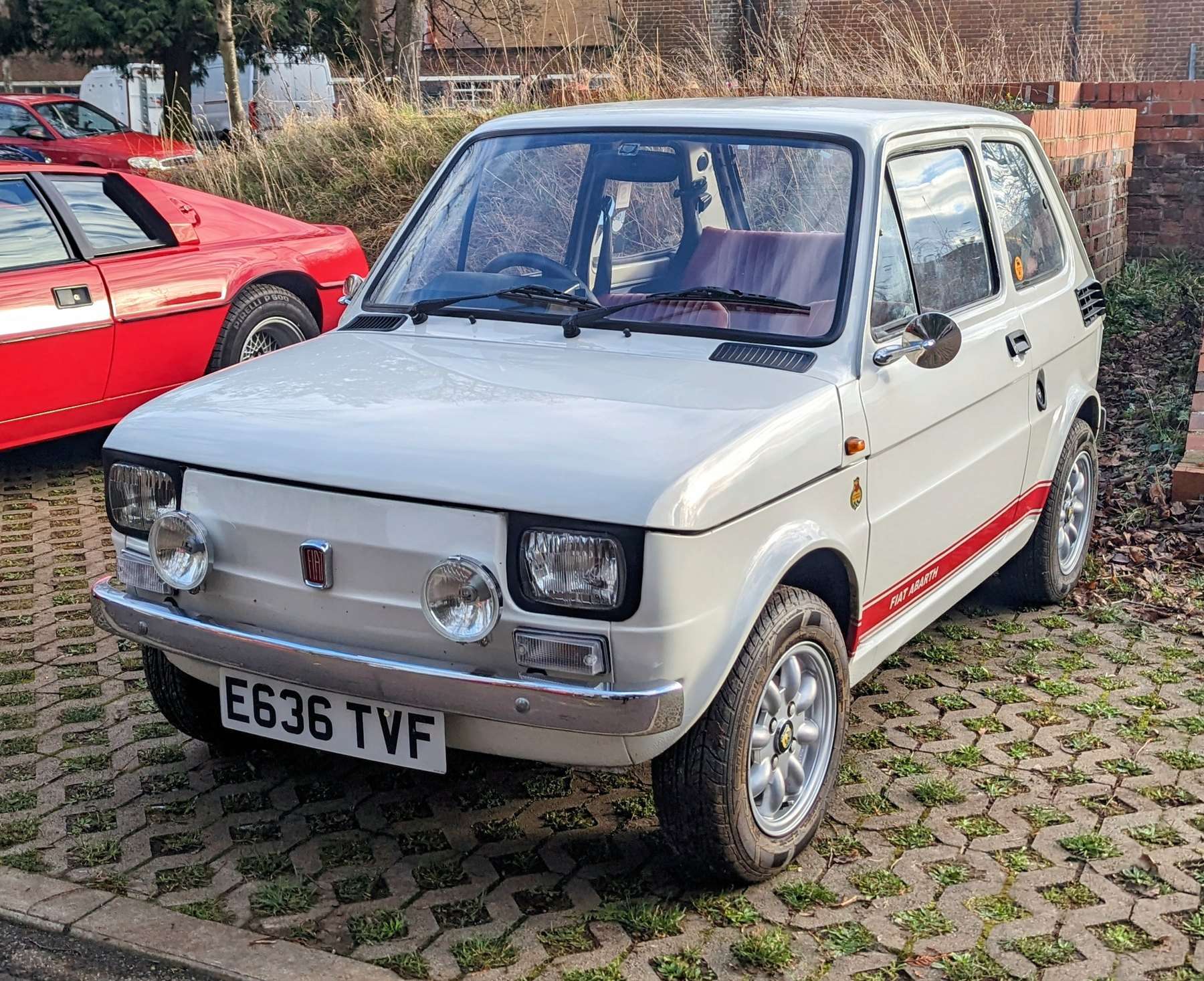 Modified red 1988 Fiat 126 with Abarth-style details