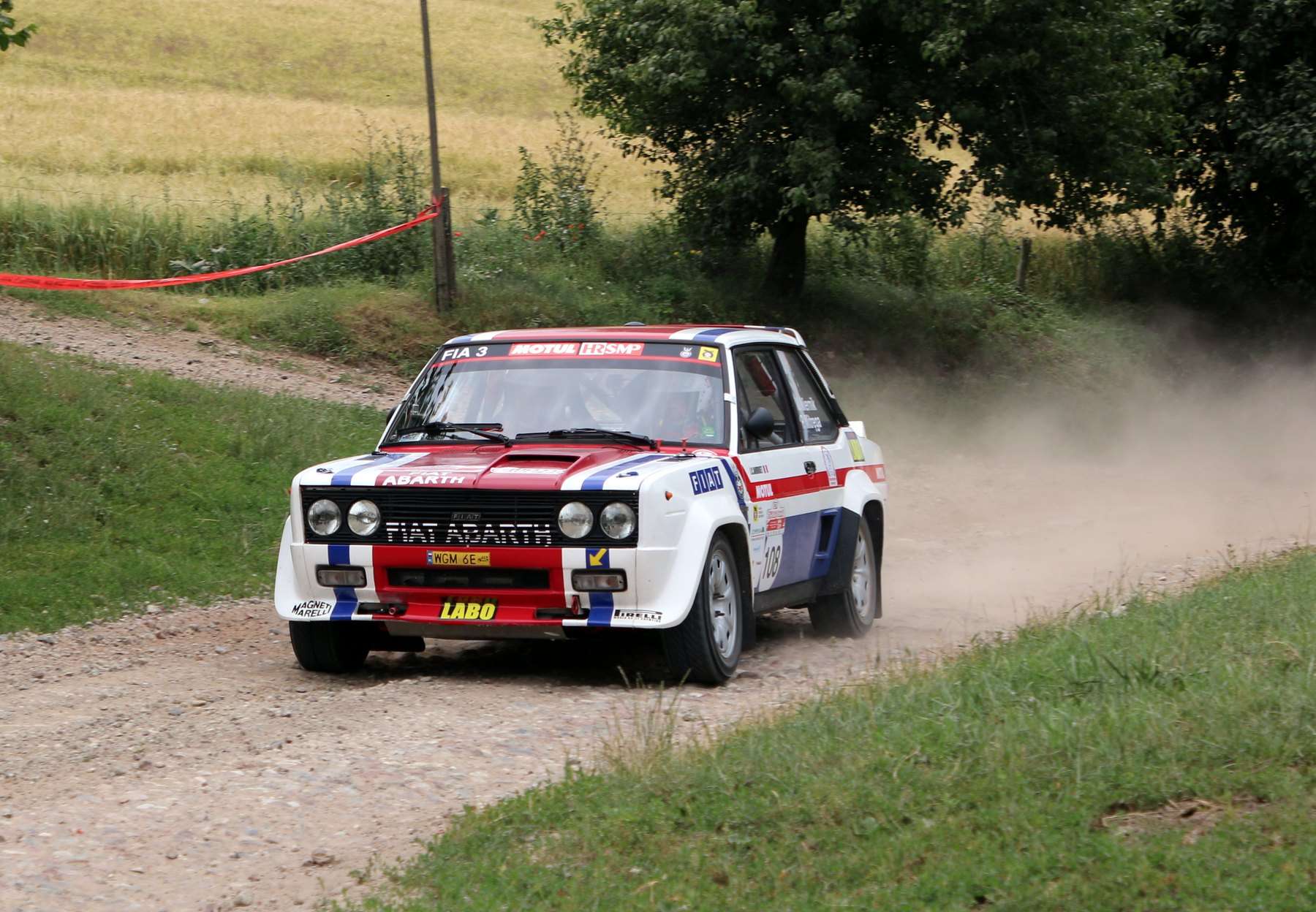 Fiat 131 Abarth historic rally car on a gravel stage