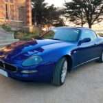 Blue Maserati Coupé 4200 GT viewed from the front three-quarter