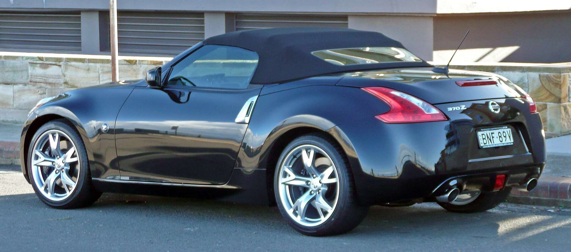 White Nissan 370Z Z34 Roadster with roof lowered