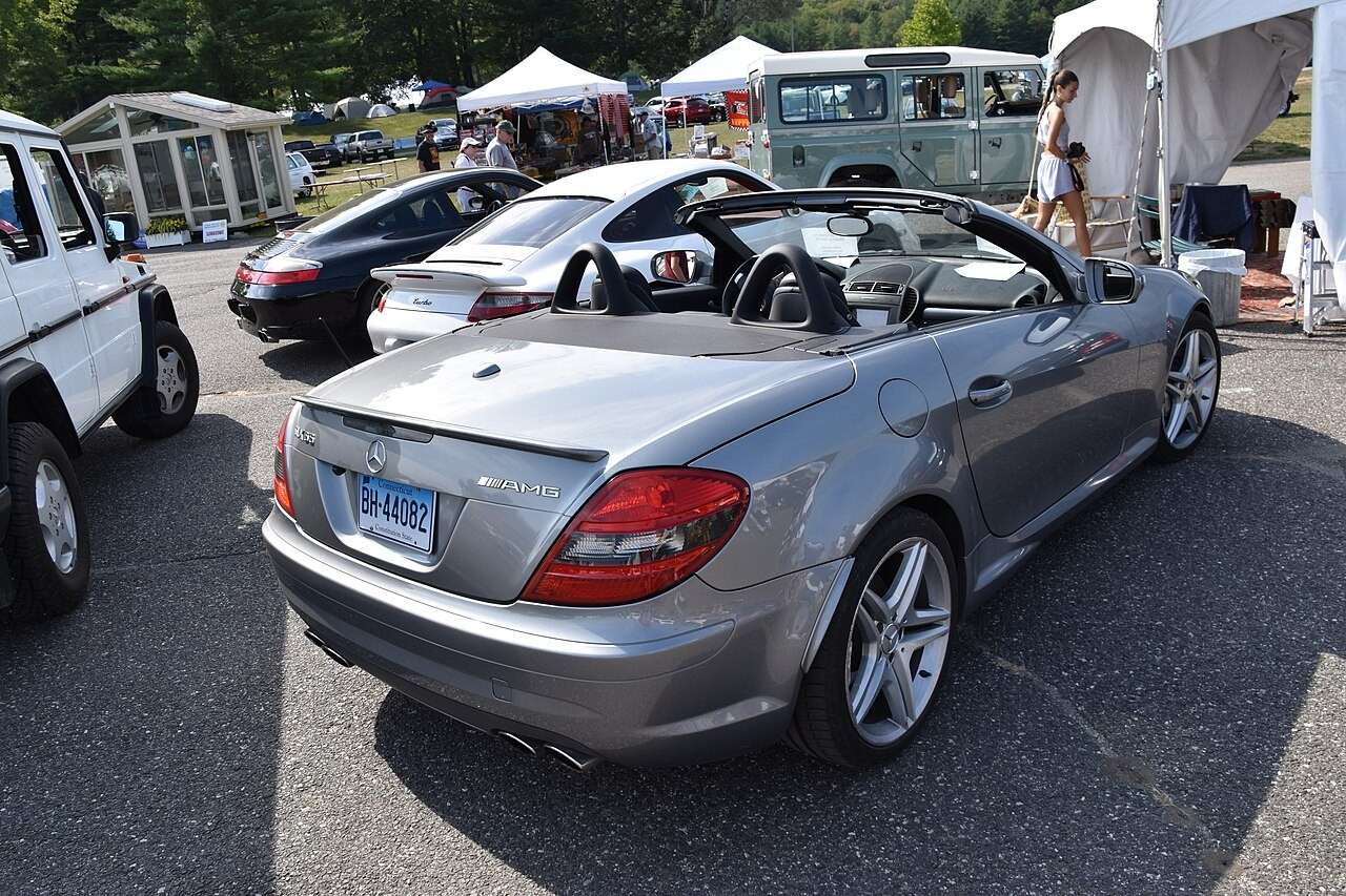 Silver R171 Mercedes-Benz SLK 55 AMG with roof lowered, rear three-quarter view