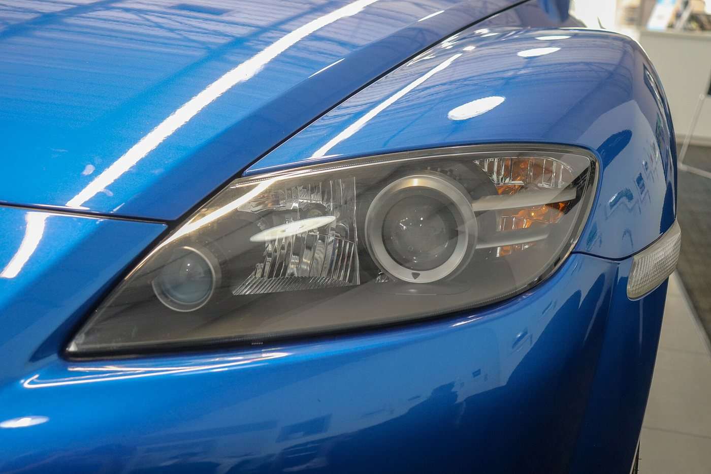 Mazda RX-8 headlamp and front-wing detail