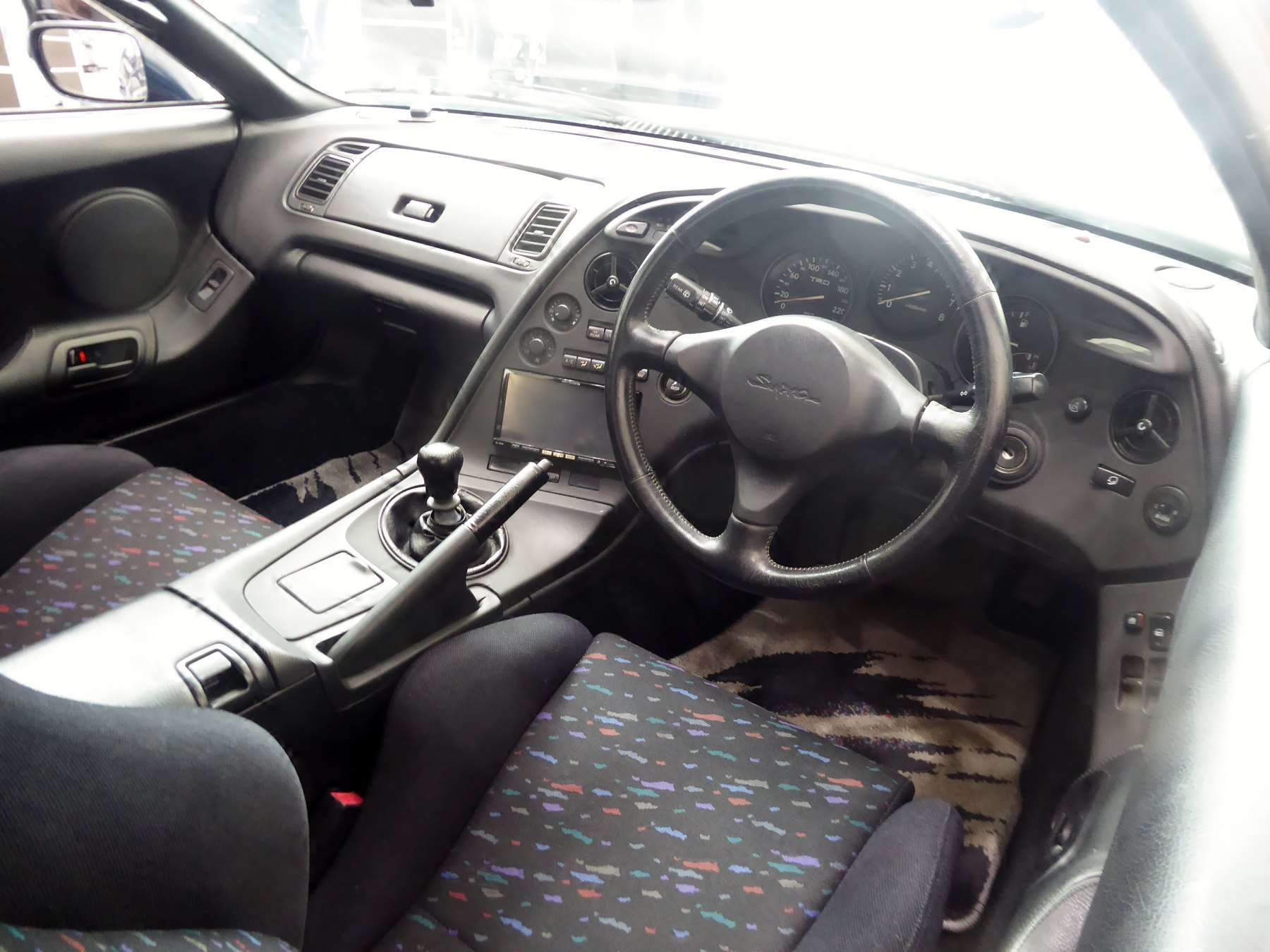 Driver-focused dashboard of a 1995 Toyota Supra RZ