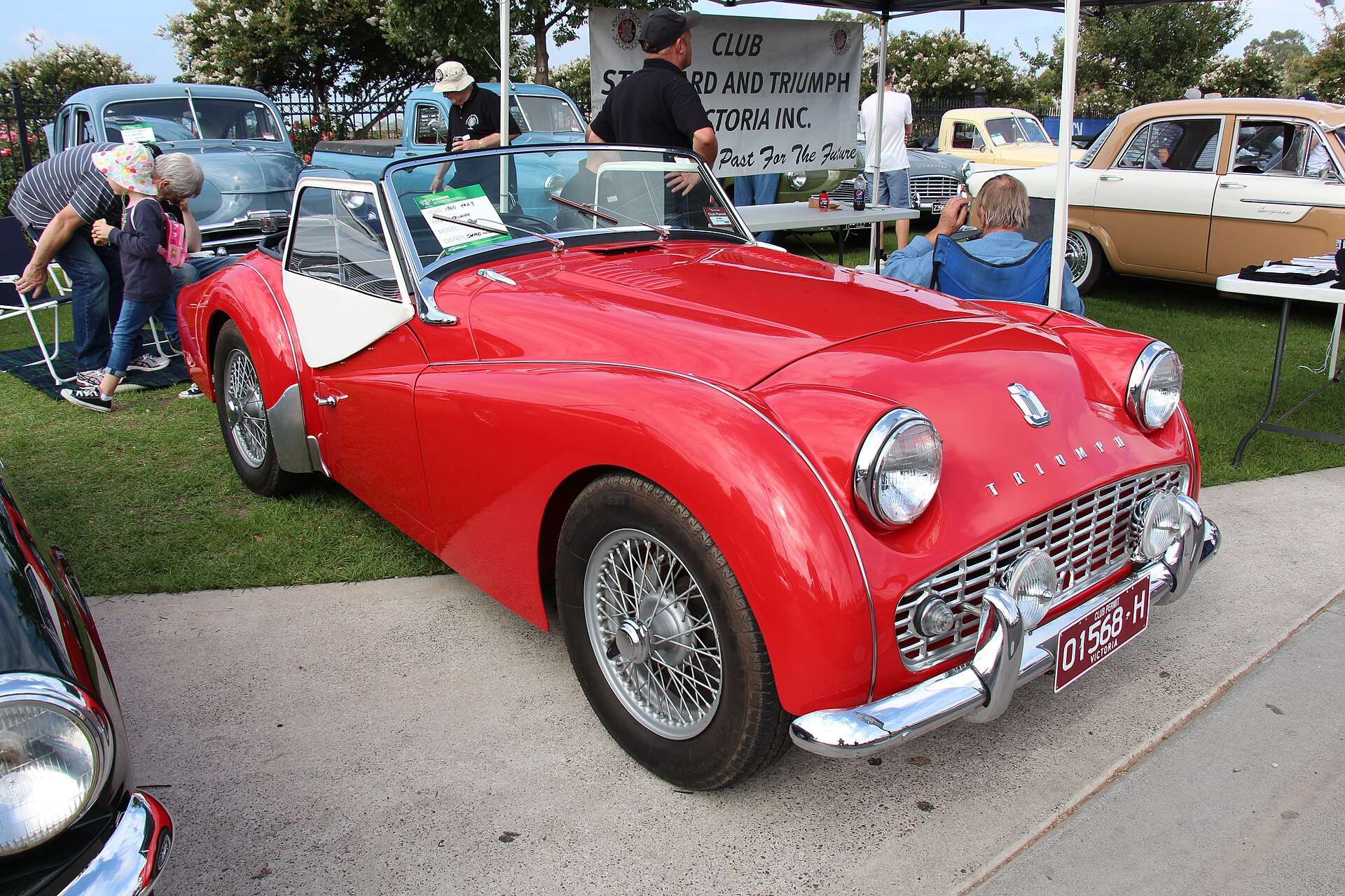 Red 1959 Triumph TR3A roadster front three-quarter view