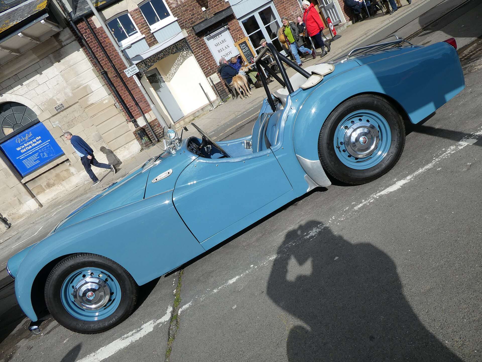 Blue 1956 Triumph TR3 front three-quarter view