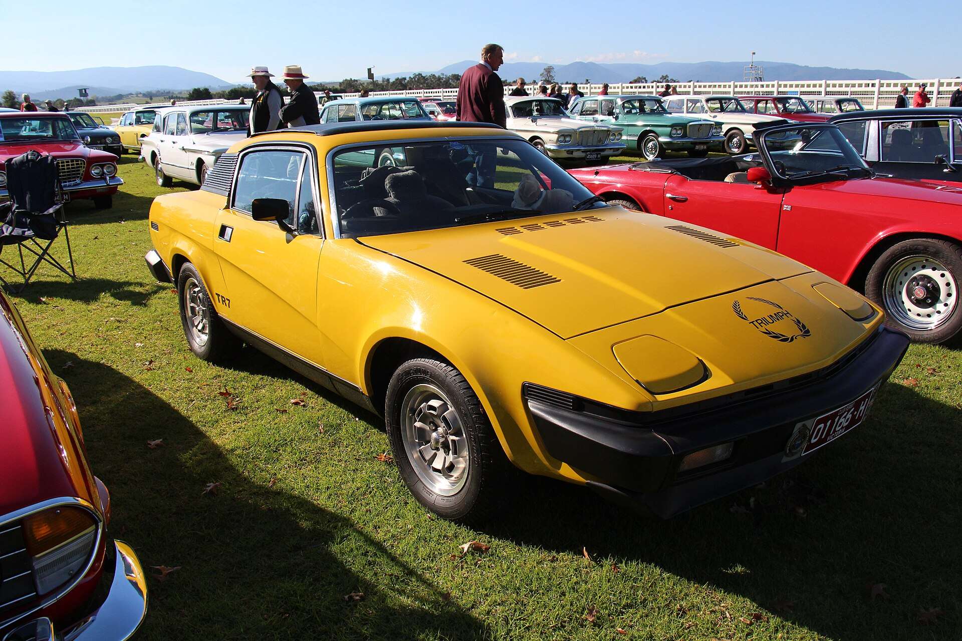 Yellow 1978 Triumph TR7 fixed-head coupe