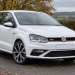White Volkswagen Polo GTI 6C 1.8 TSI in the British countryside — illustrative artwork
