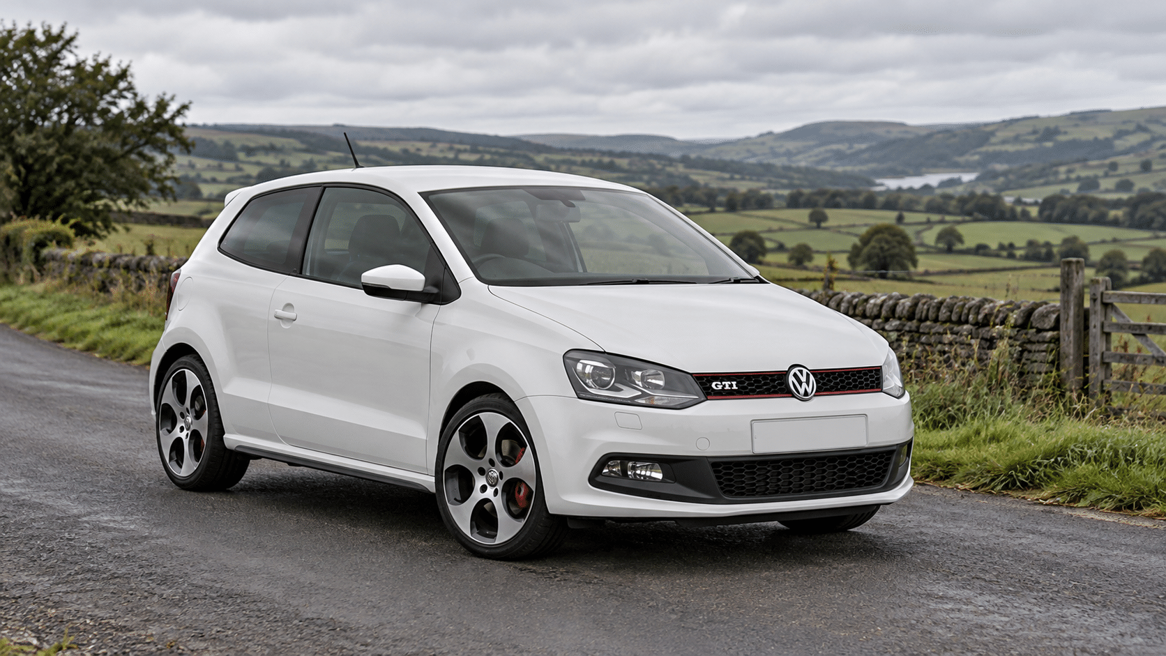 White Volkswagen Polo GTI 6R on a British country road — illustrative artwork