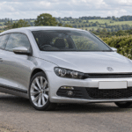 Silver Volkswagen Scirocco Mk3 on a British country road — illustrative artwork