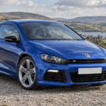 Rising blue Volkswagen Scirocco R in the British countryside — illustrative artwork